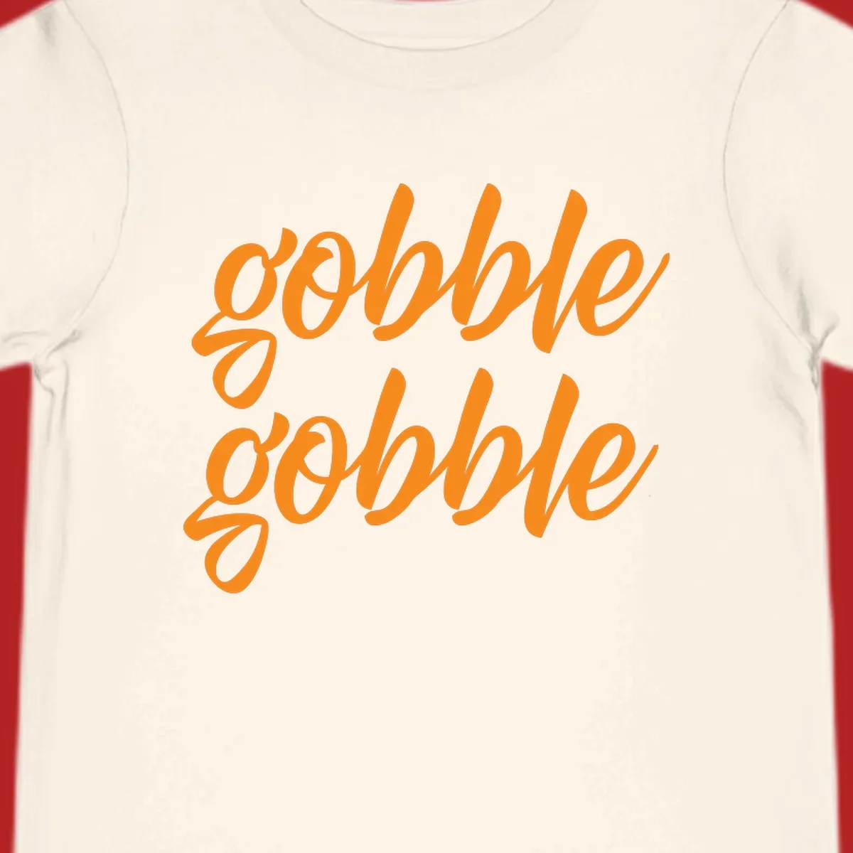 Orange script text 'gobble gobble' repeated twice. Thanksgiving phrase.