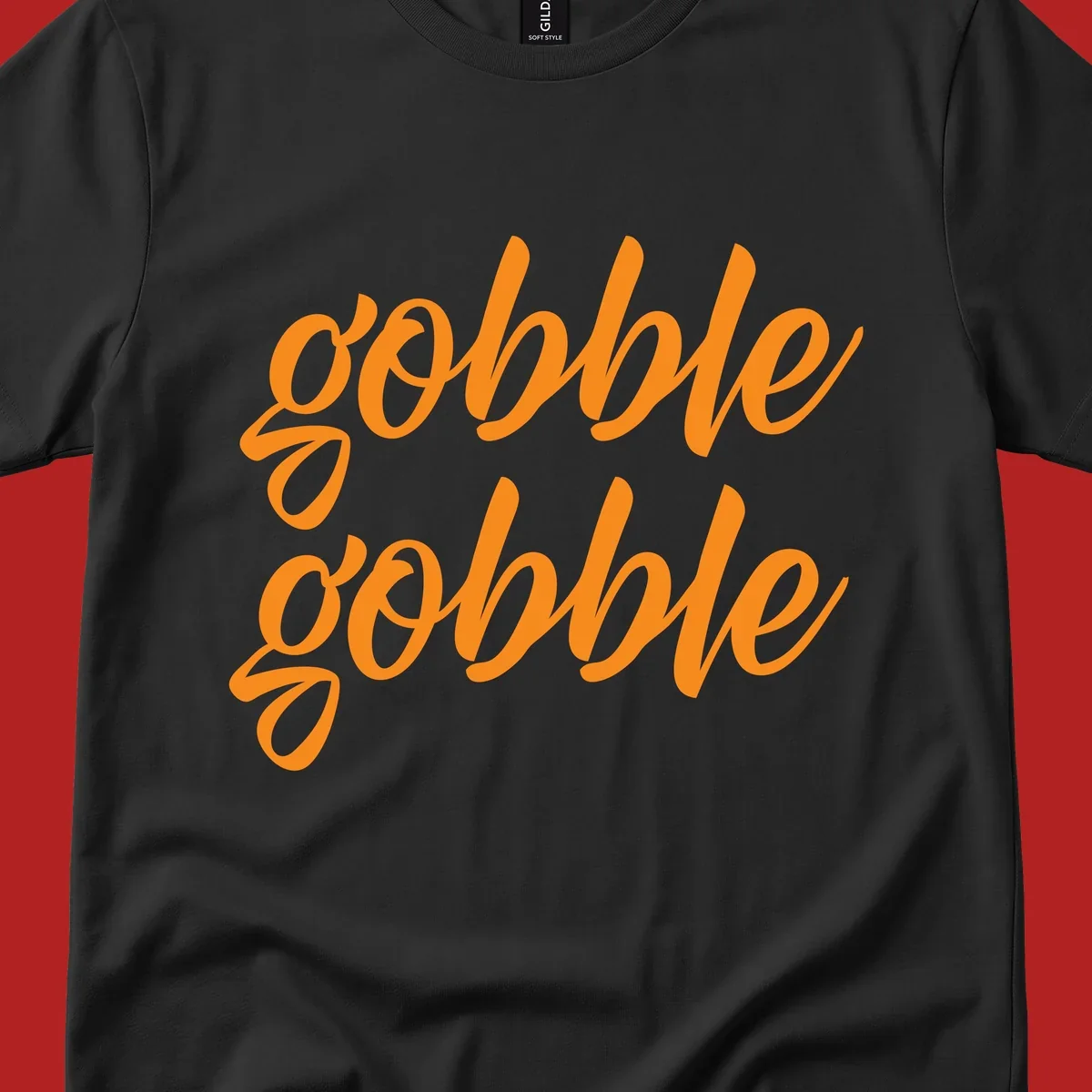 Orange script text 'gobble gobble' repeated twice. Thanksgiving phrase.
