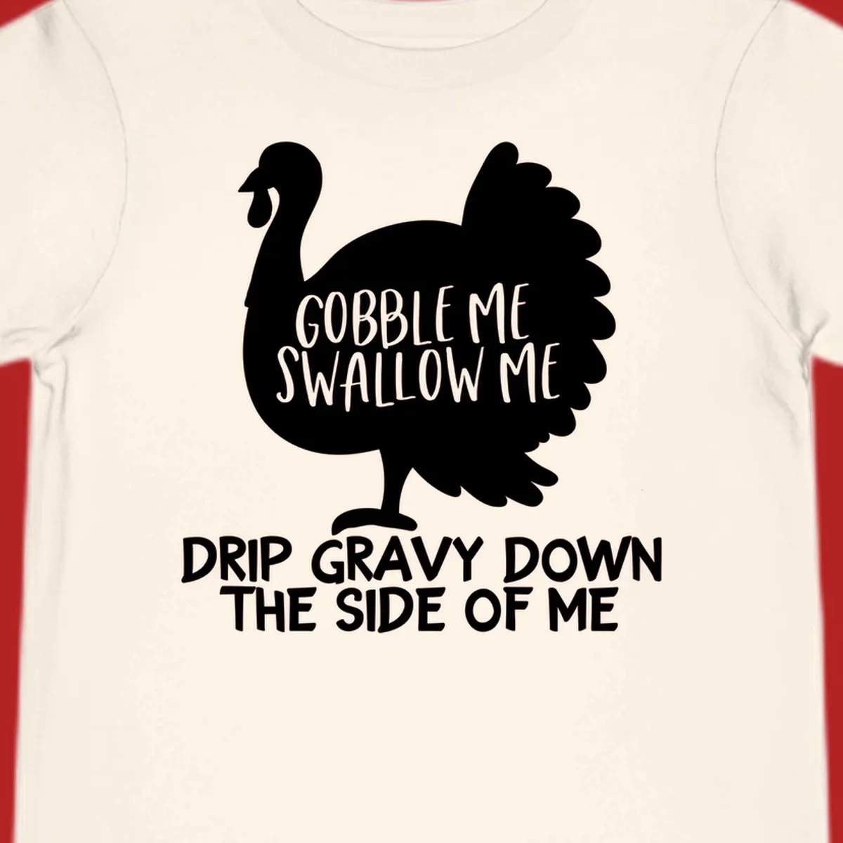 Thanksgiving turkey design with text, featuring a silhouette and the phrase 'Gobble Me Swallow Me Drip Gravy Down The Side Of Me'.