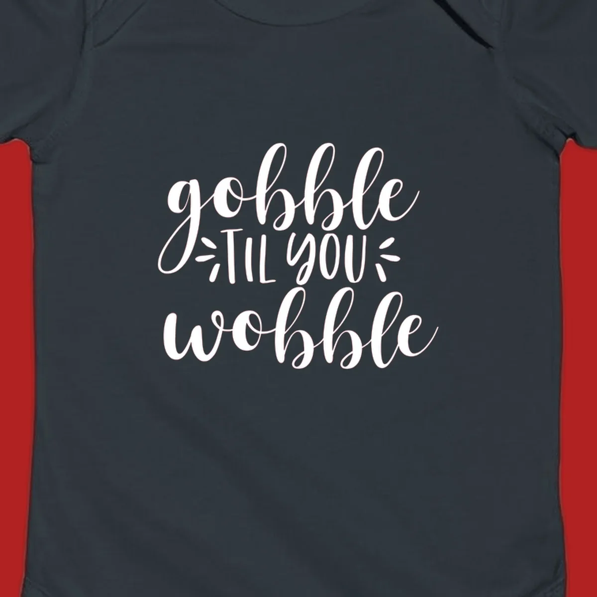 Gobble 'til you wobble thanksgiving phrase in white script font.