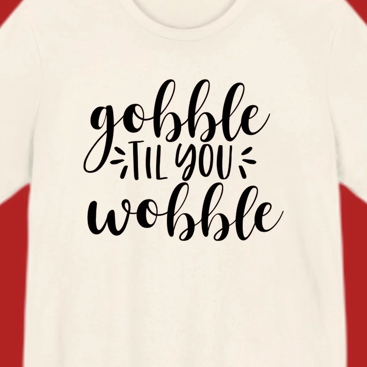 Gobble 'til you wobble thanksgiving phrase in white script font.