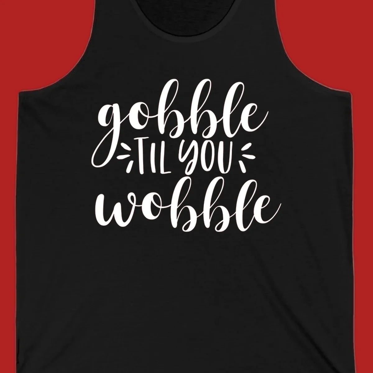 Gobble 'til you wobble thanksgiving phrase in white script font.