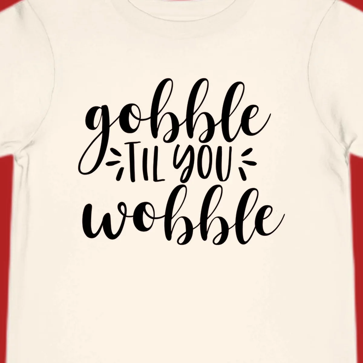 Gobble 'til you wobble thanksgiving phrase in white script font.