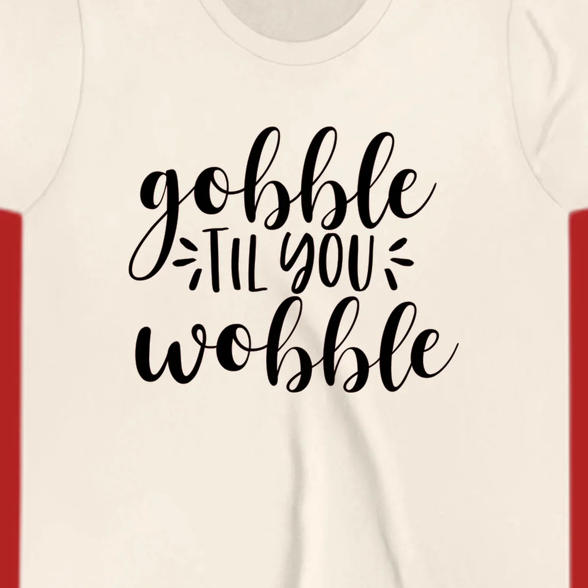 Gobble 'til you wobble thanksgiving phrase in white script font.