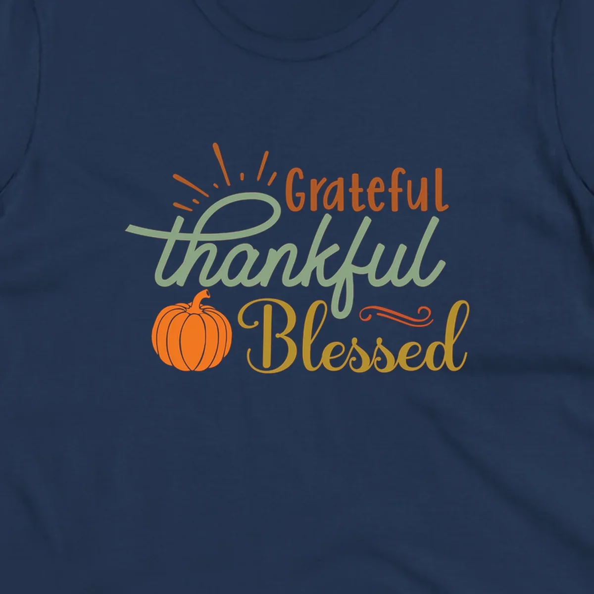 Grateful thankful blessed text with pumpkin and sun rays, autumn holiday design.