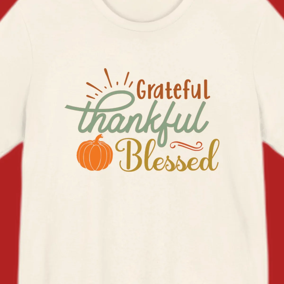 Grateful thankful blessed text with pumpkin and sun rays, autumn holiday design.