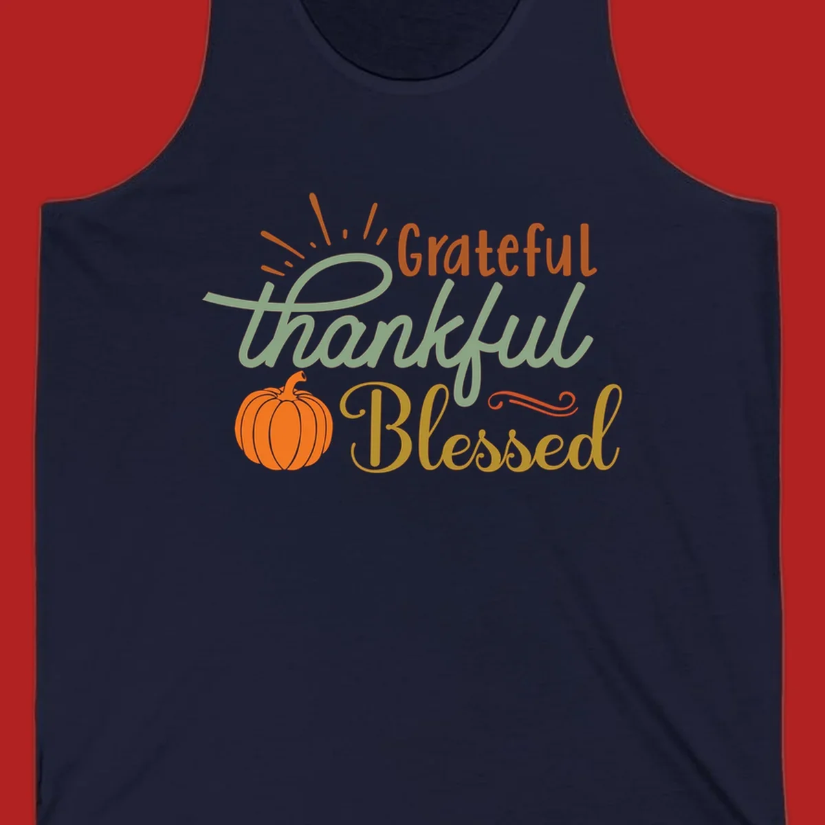 Grateful thankful blessed text with pumpkin and sun rays, autumn holiday design.