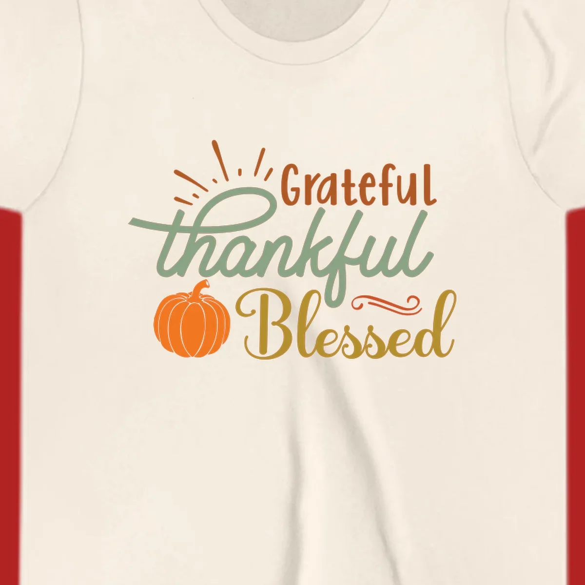 Grateful thankful blessed text with pumpkin and sun rays, autumn holiday design.