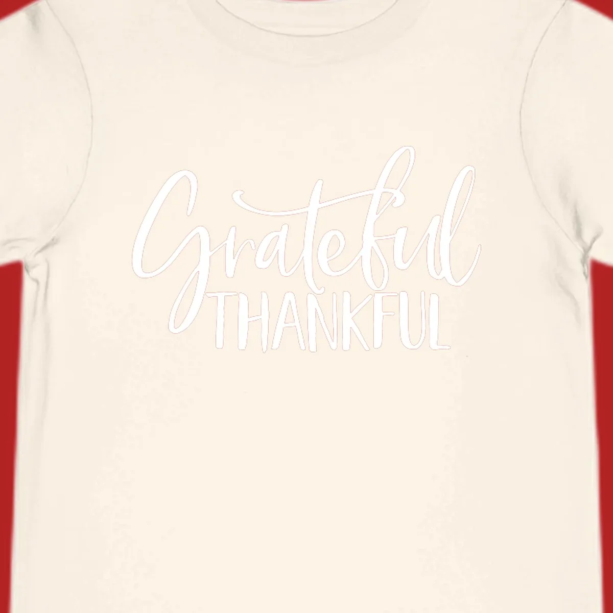 Grateful Thankful typography design with white script and block text.