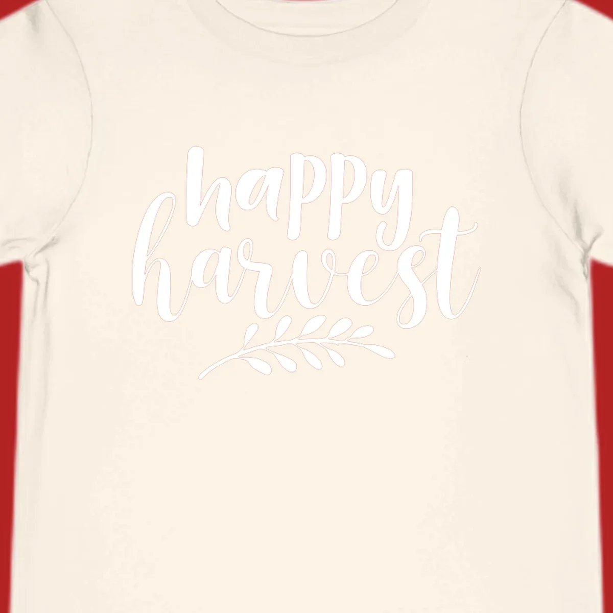 Happy Harvest text with fall leaves graphic, white on black background