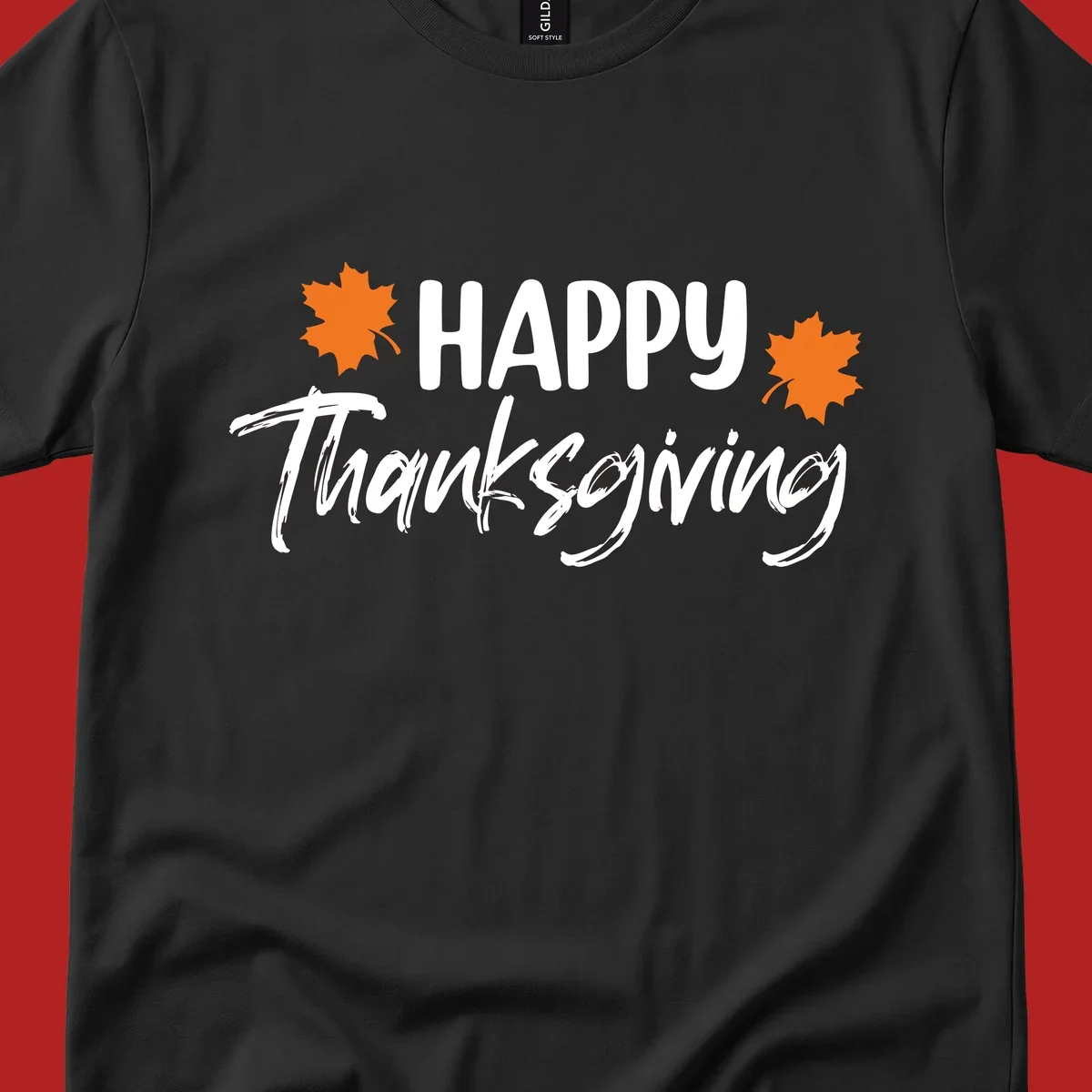 Happy Thanksgiving text with orange maple leaves, holiday design.