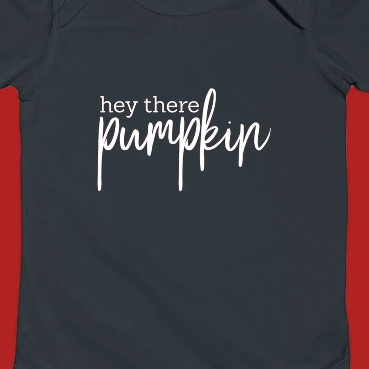 White text design with "hey there" in block font and "pumpkin" in script font, on a black background.