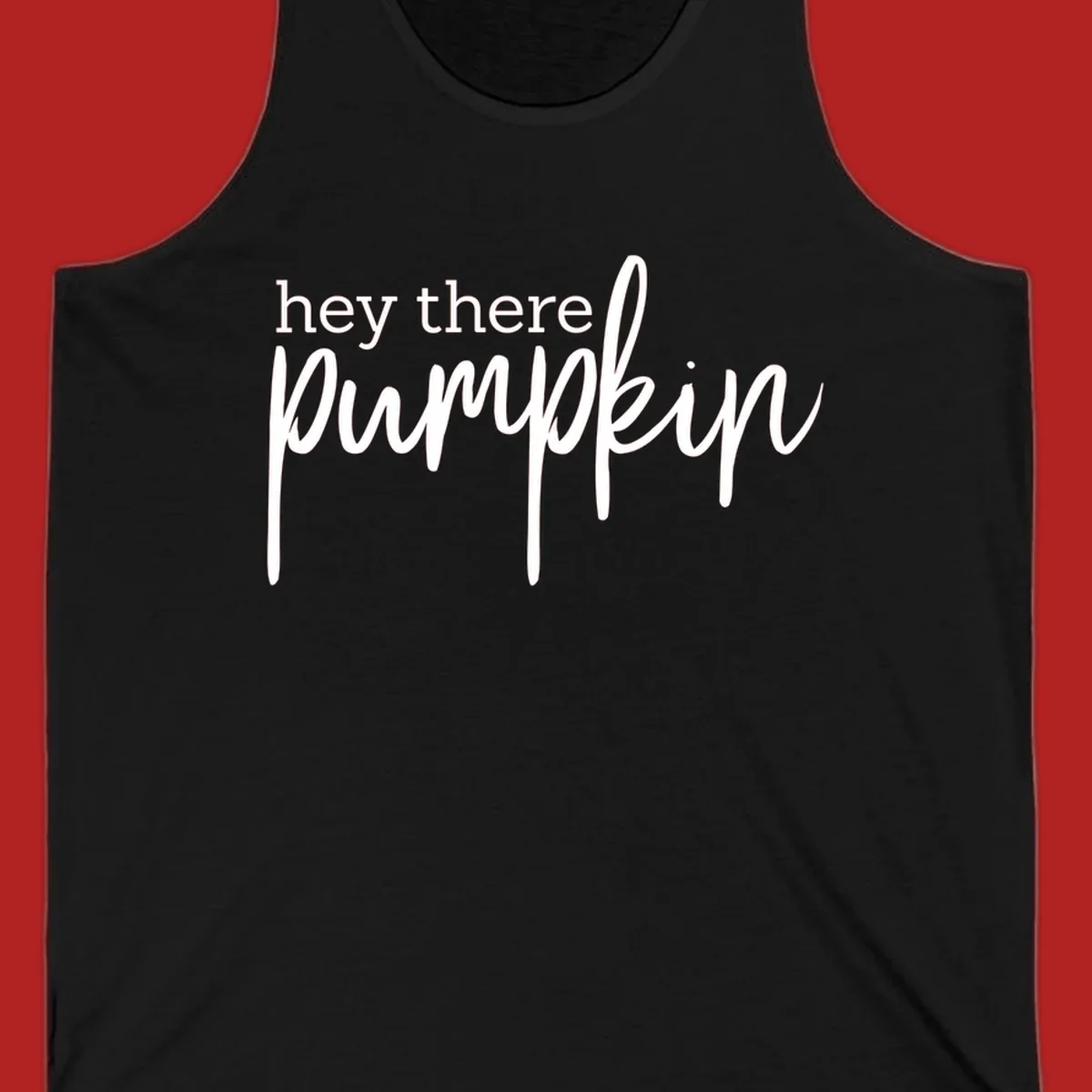 White text design with "hey there" in block font and "pumpkin" in script font, on a black background.