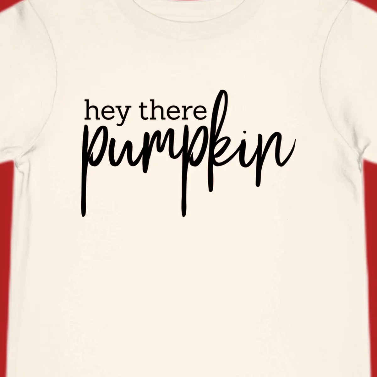 White text design with "hey there" in block font and "pumpkin" in script font, on a black background.