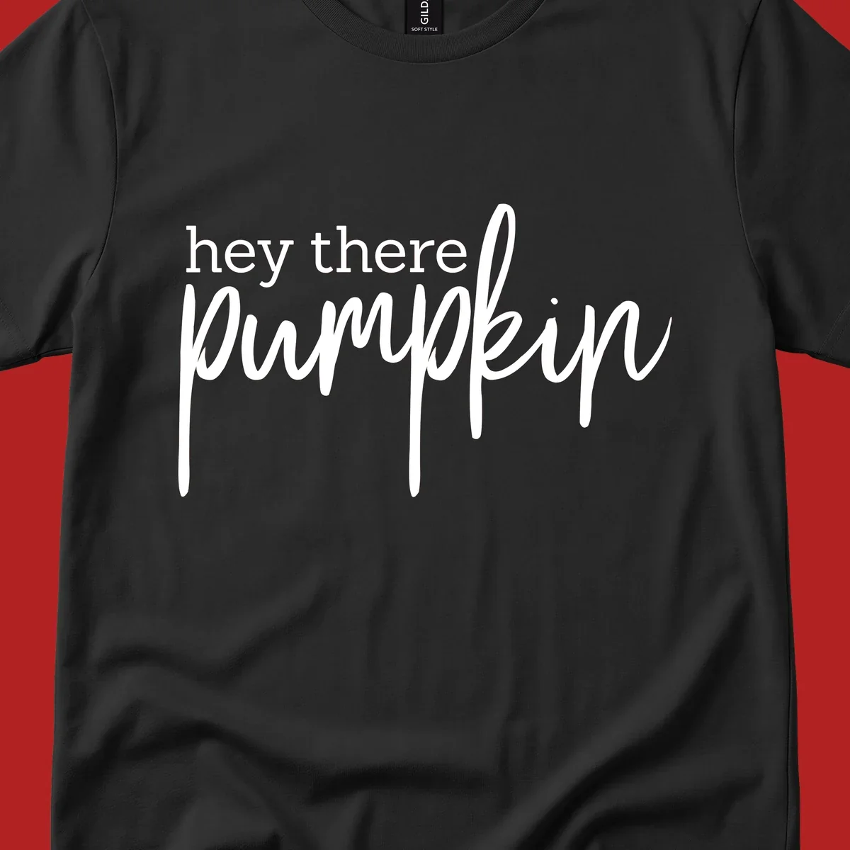 White text design with "hey there" in block font and "pumpkin" in script font, on a black background.