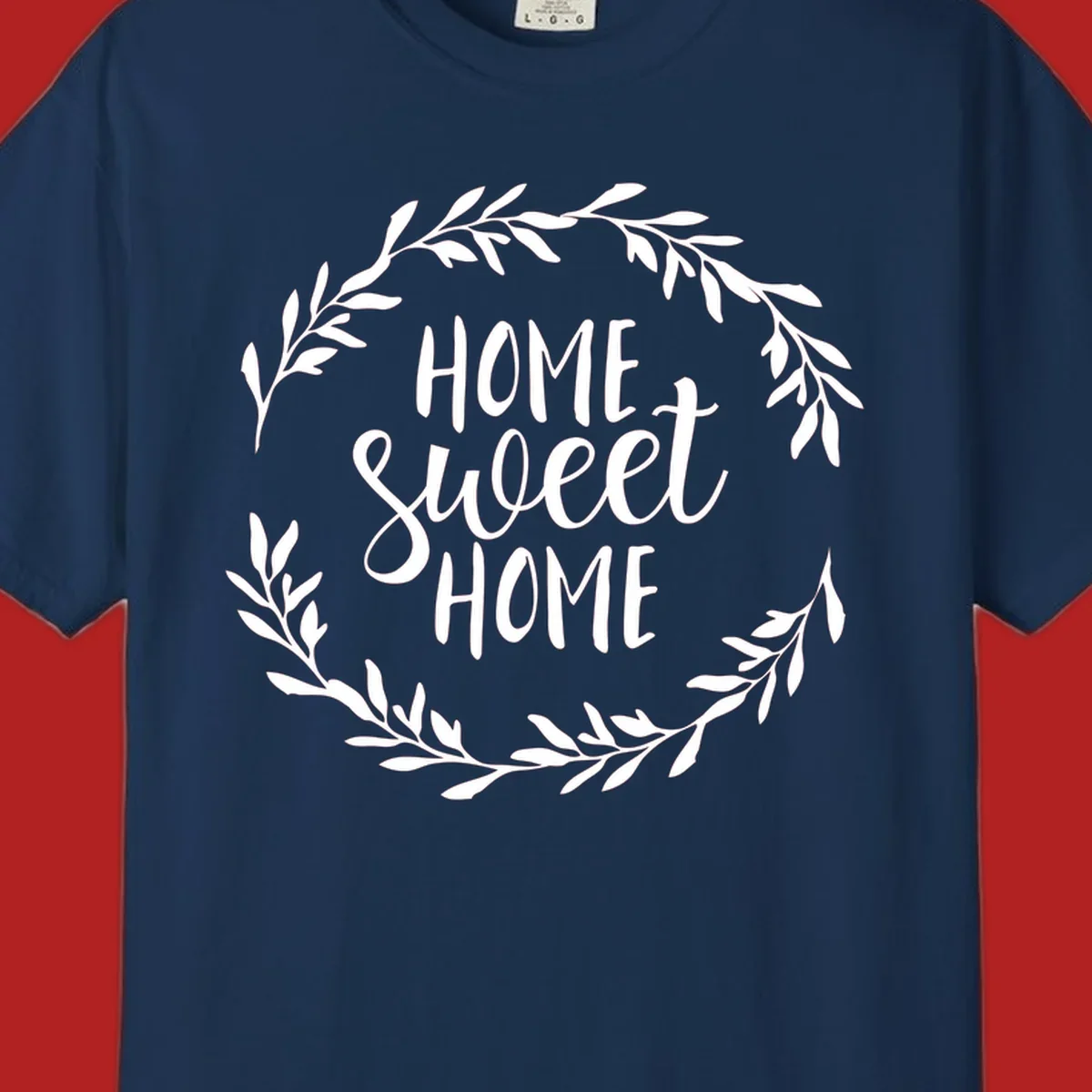 White 'Home Sweet Home' text with a floral wreath on a dark background.