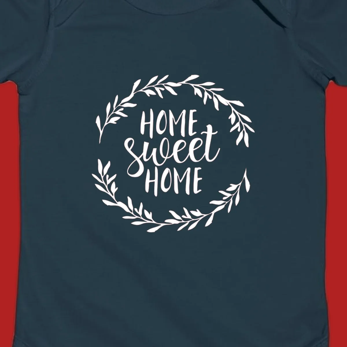 White 'Home Sweet Home' text with a floral wreath on a dark background.