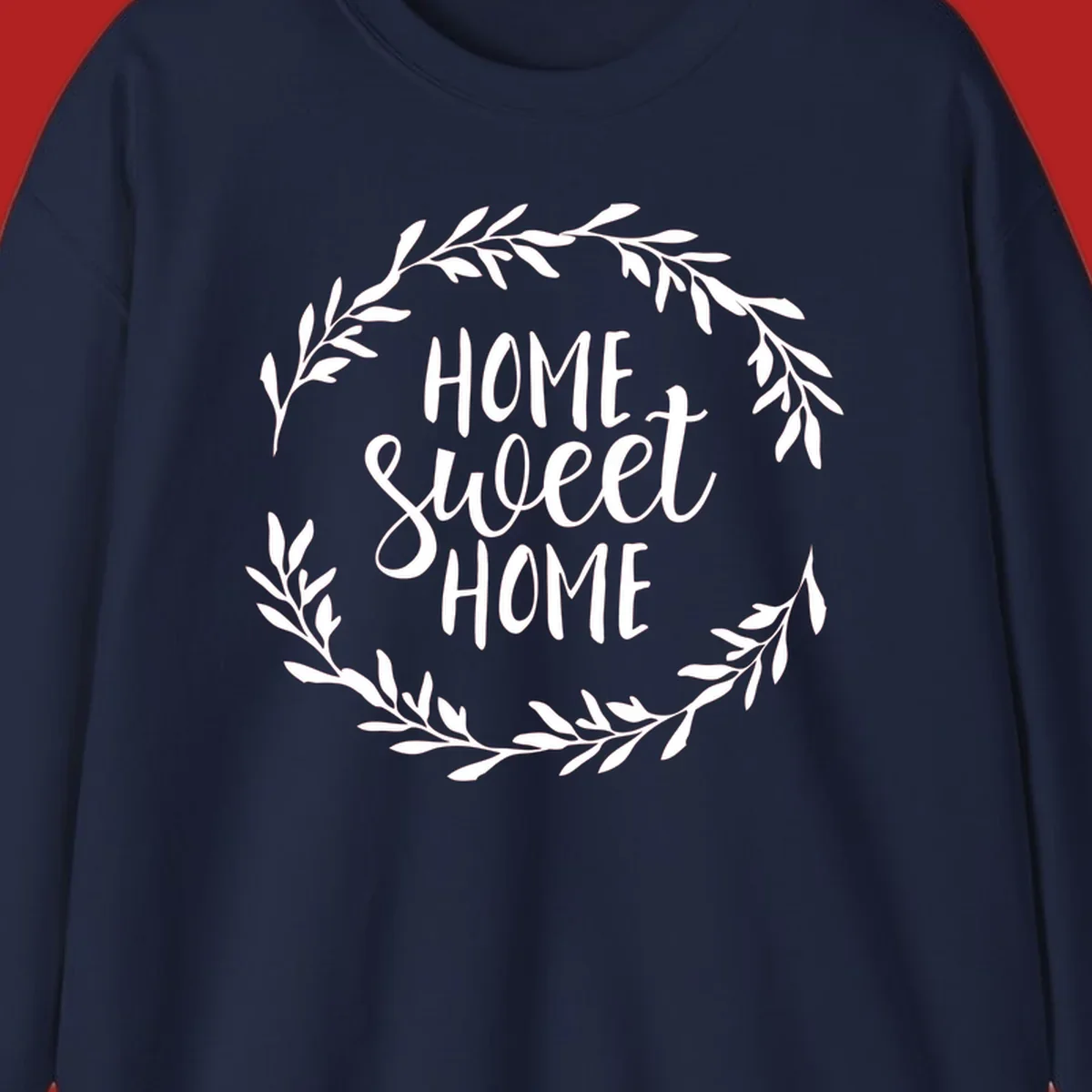 White 'Home Sweet Home' text with a floral wreath on a dark background.