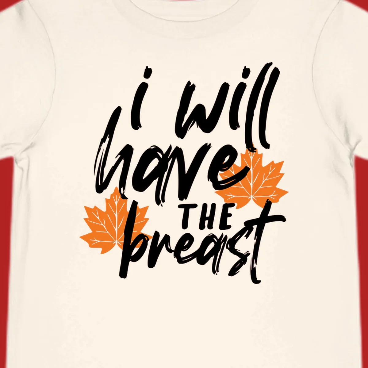 Thanksgiving pun design with text "i will have THE breast" and orange maple leaves.