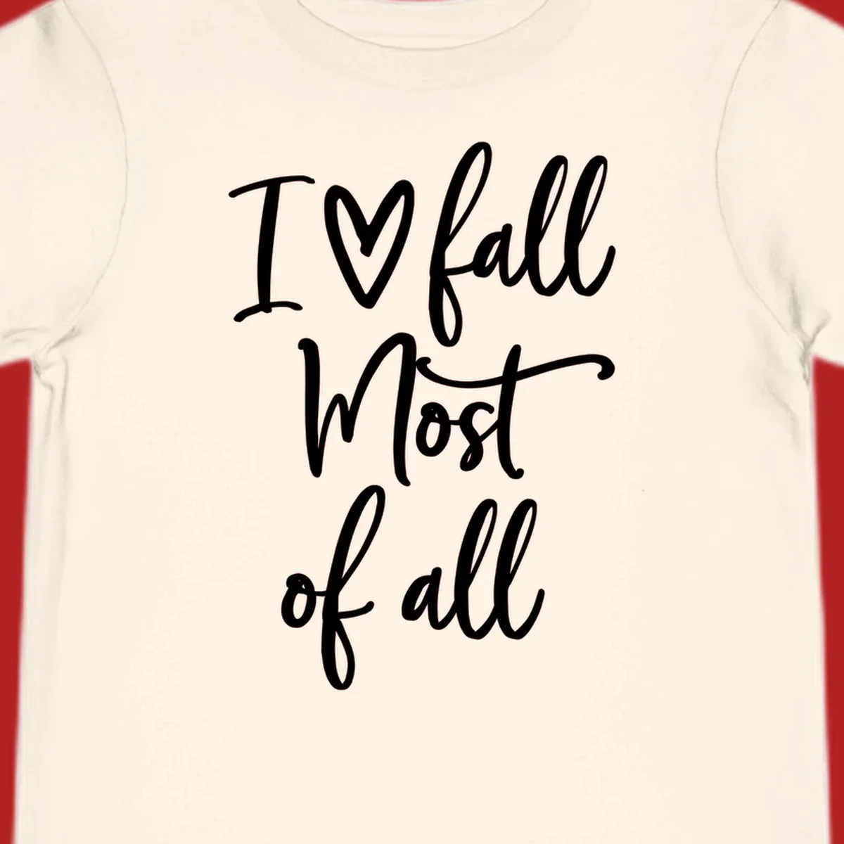 Hand-drawn script text 'I ♡ fall Most of all' in white on a black background.