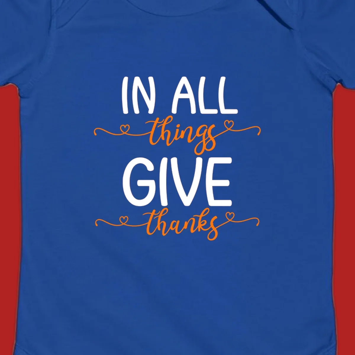 In all things give thanks phrase with script font and heart accents.