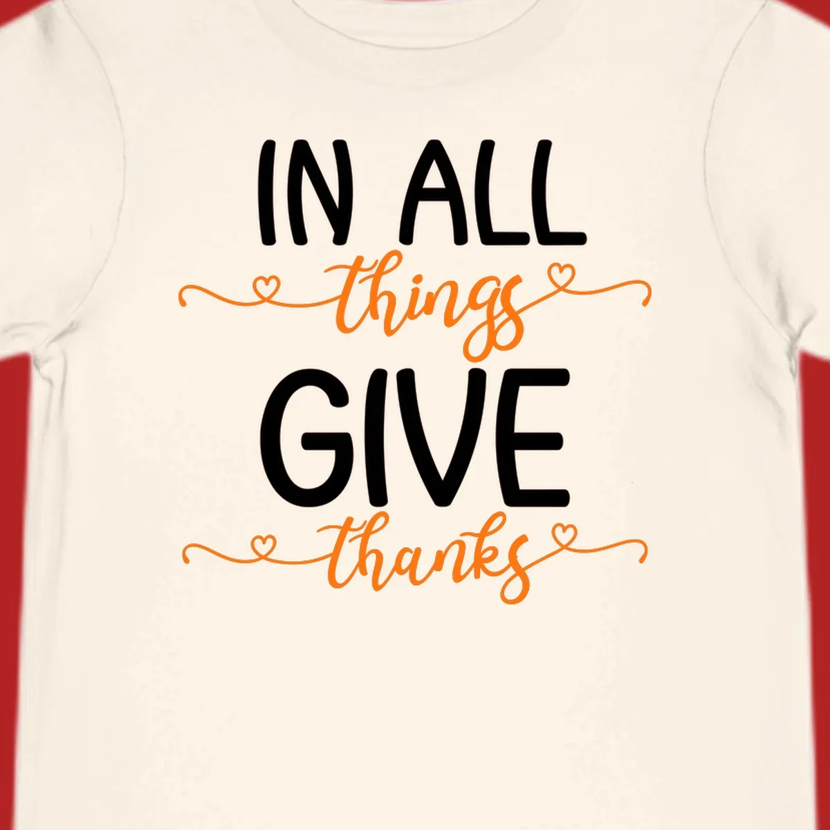 In all things give thanks phrase with script font and heart accents.