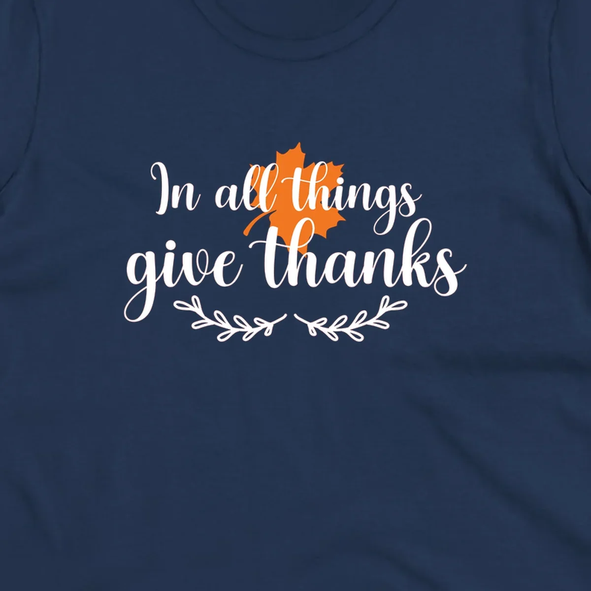 Thanksgiving typography with orange maple leaf and 'In all things give thanks' text.