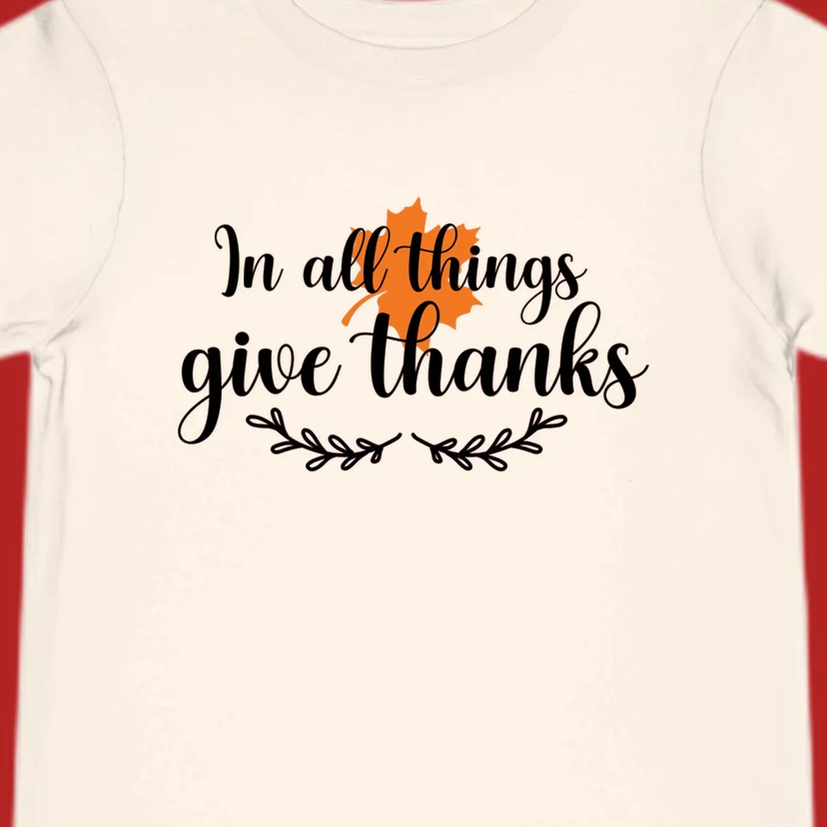 Thanksgiving typography with orange maple leaf and 'In all things give thanks' text.
