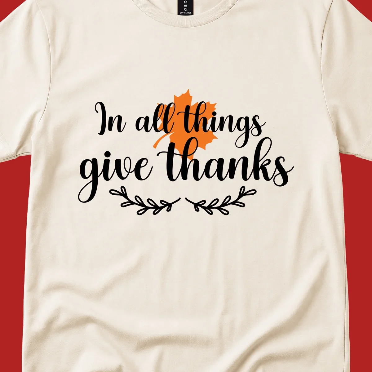 Thanksgiving typography with orange maple leaf and 'In all things give thanks' text.