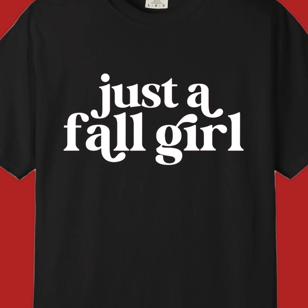 Just a Fall Girl typography design in white.