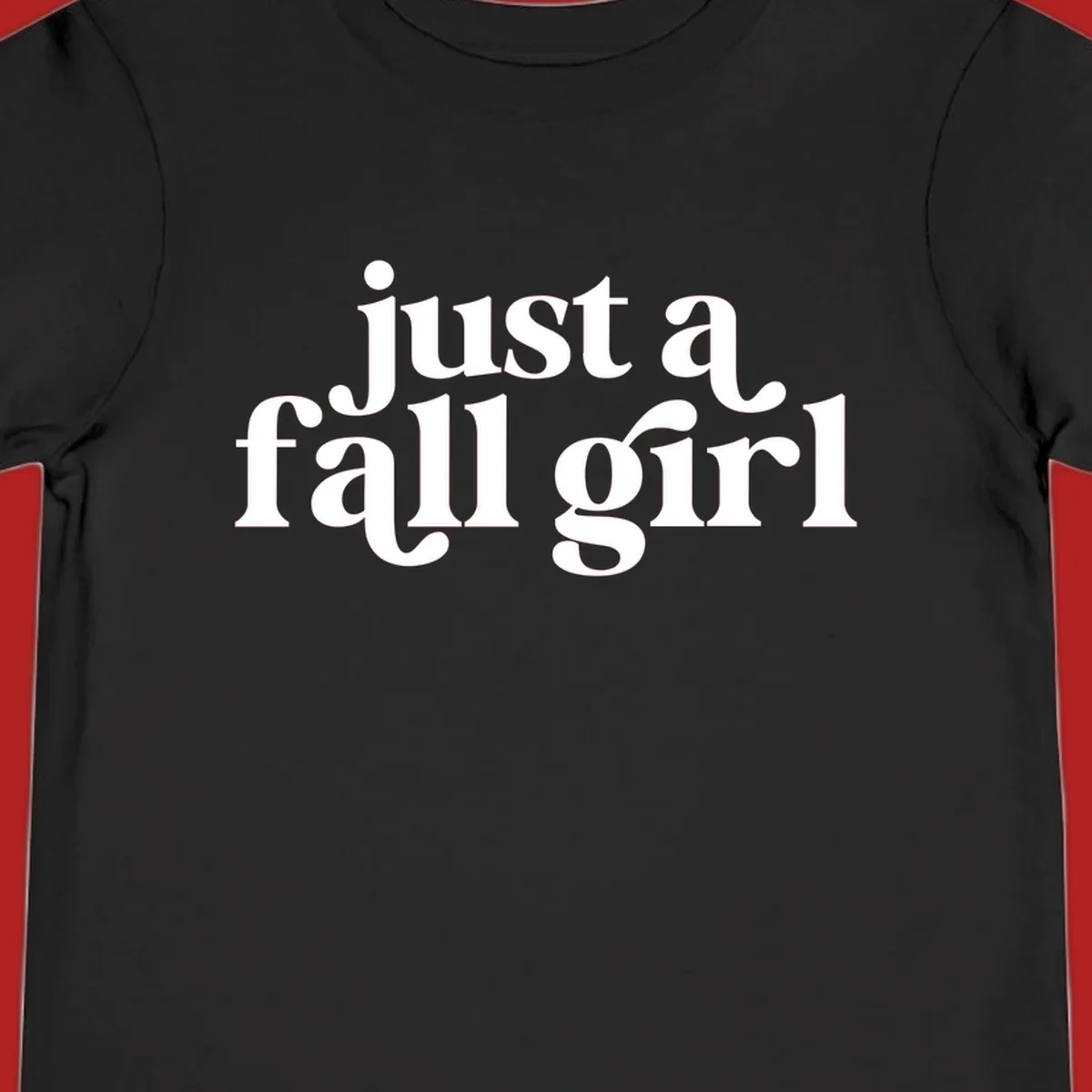 Just a Fall Girl typography design in white.