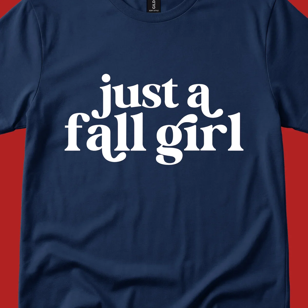 Just a Fall Girl typography design in white.