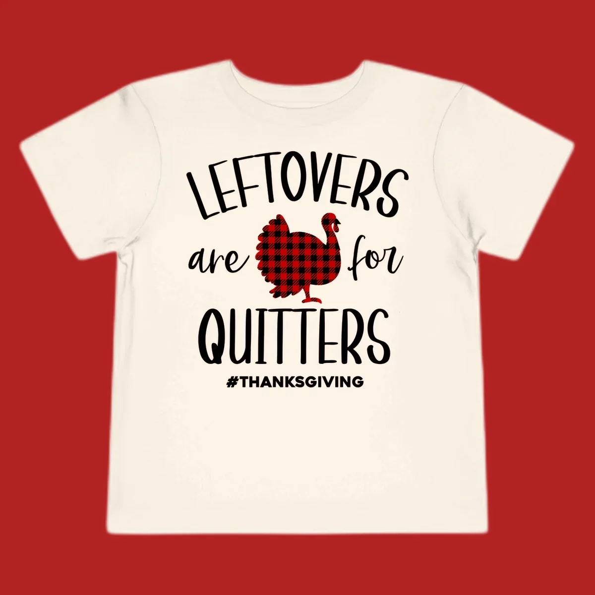 Leftovers are for quitters thanksgiving turkey graphic tee. White text, red and white gingham turkey.