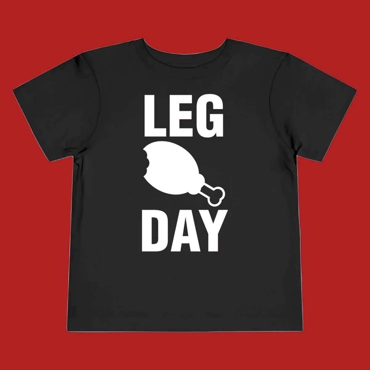 Bold text LEG DAY with a bitten chicken leg graphic in between.