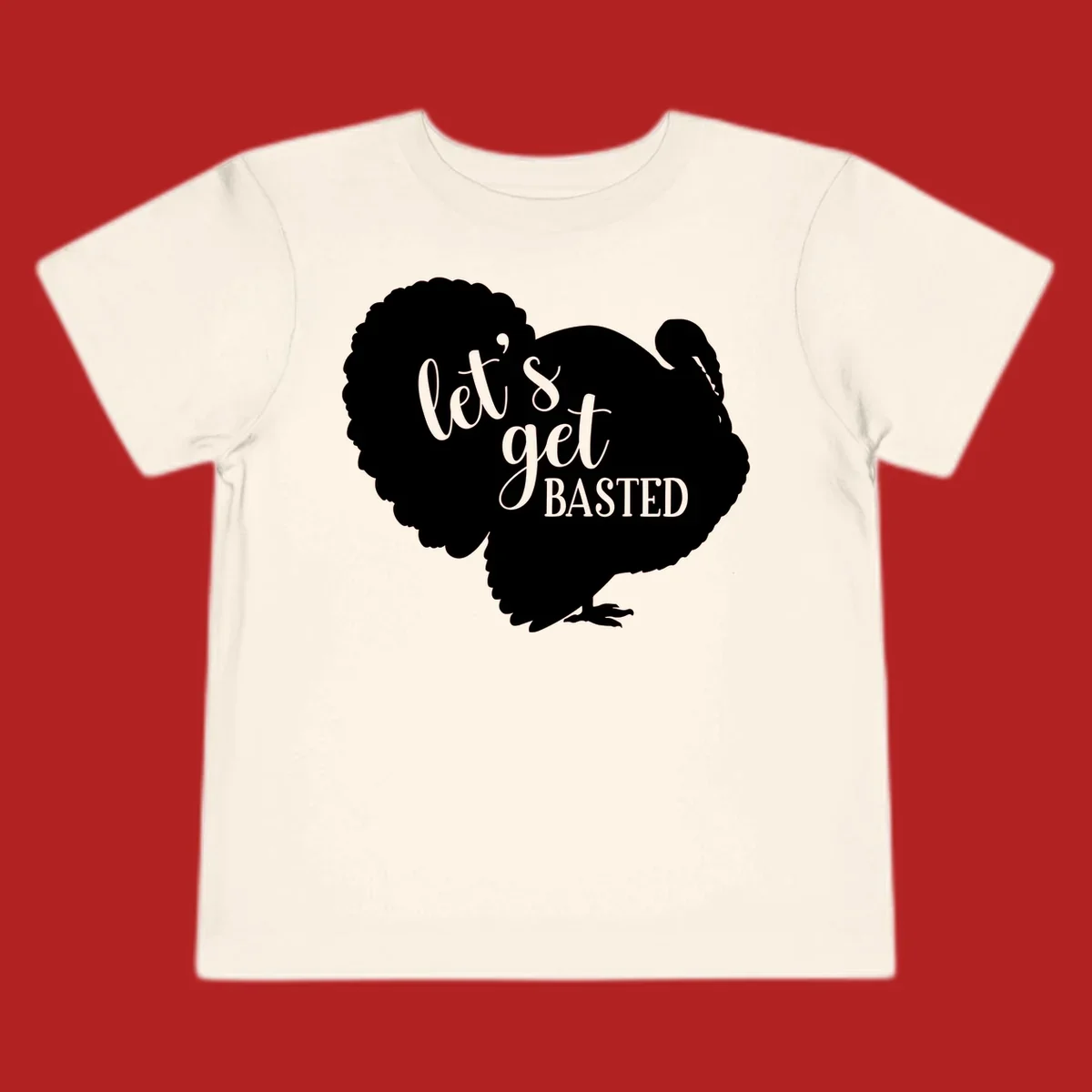 Thanksgiving turkey silhouette with text 'let's get BASTED', for holiday gatherings.