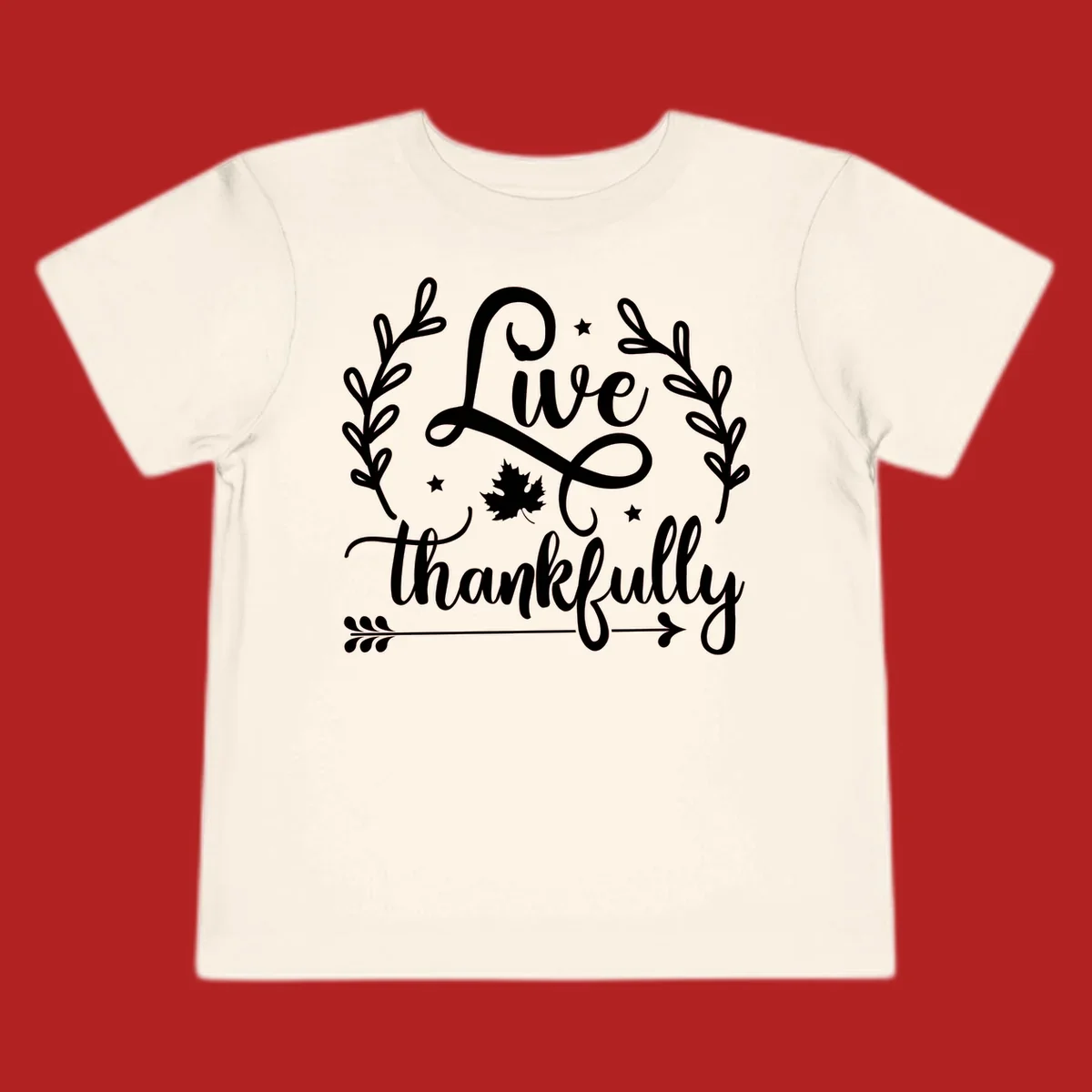 Live thankfully fall design with script text, leaves, and stars.