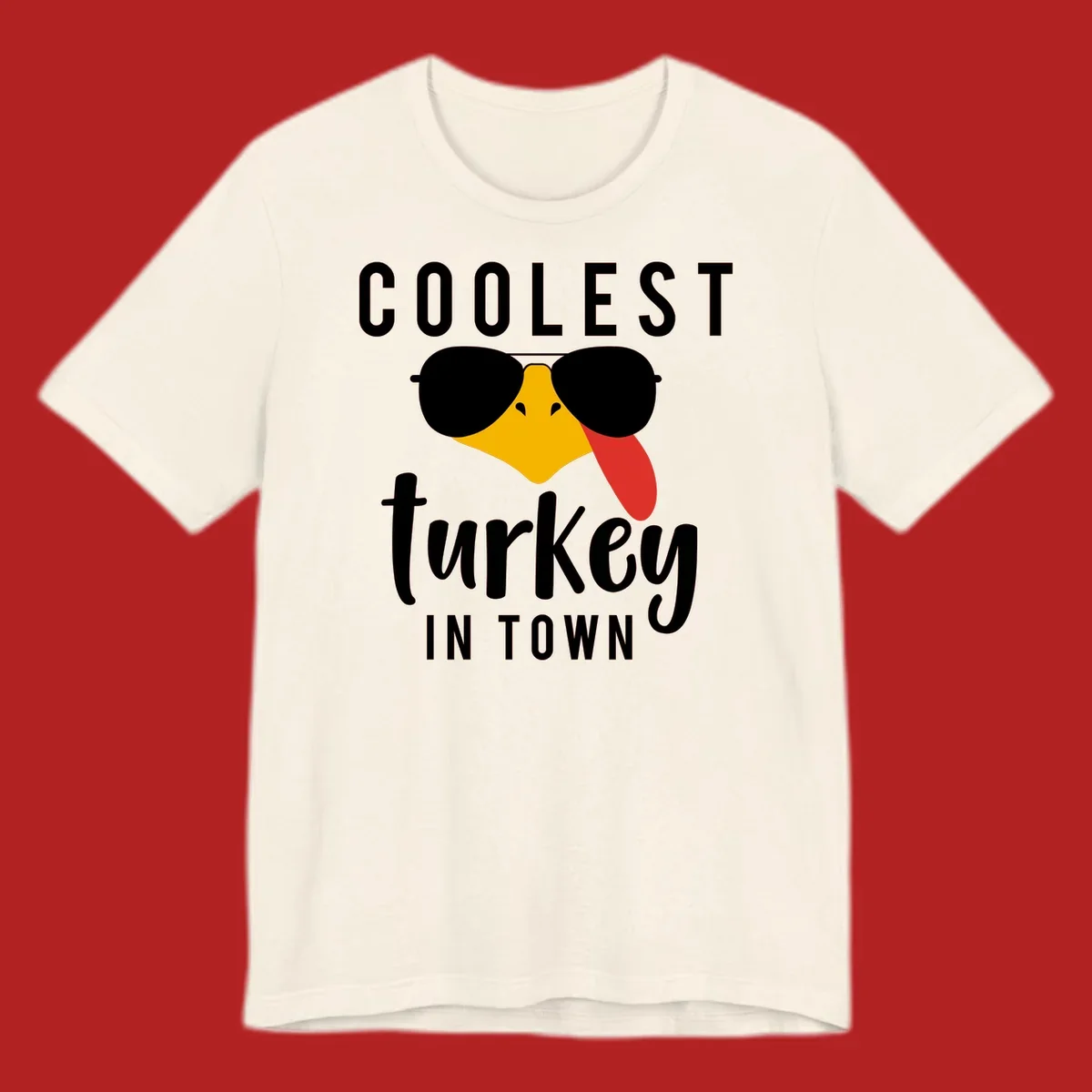 Coolest Turkey In Town Thanksgiving design with a cartoon turkey wearing sunglasses and sticking its tongue out.