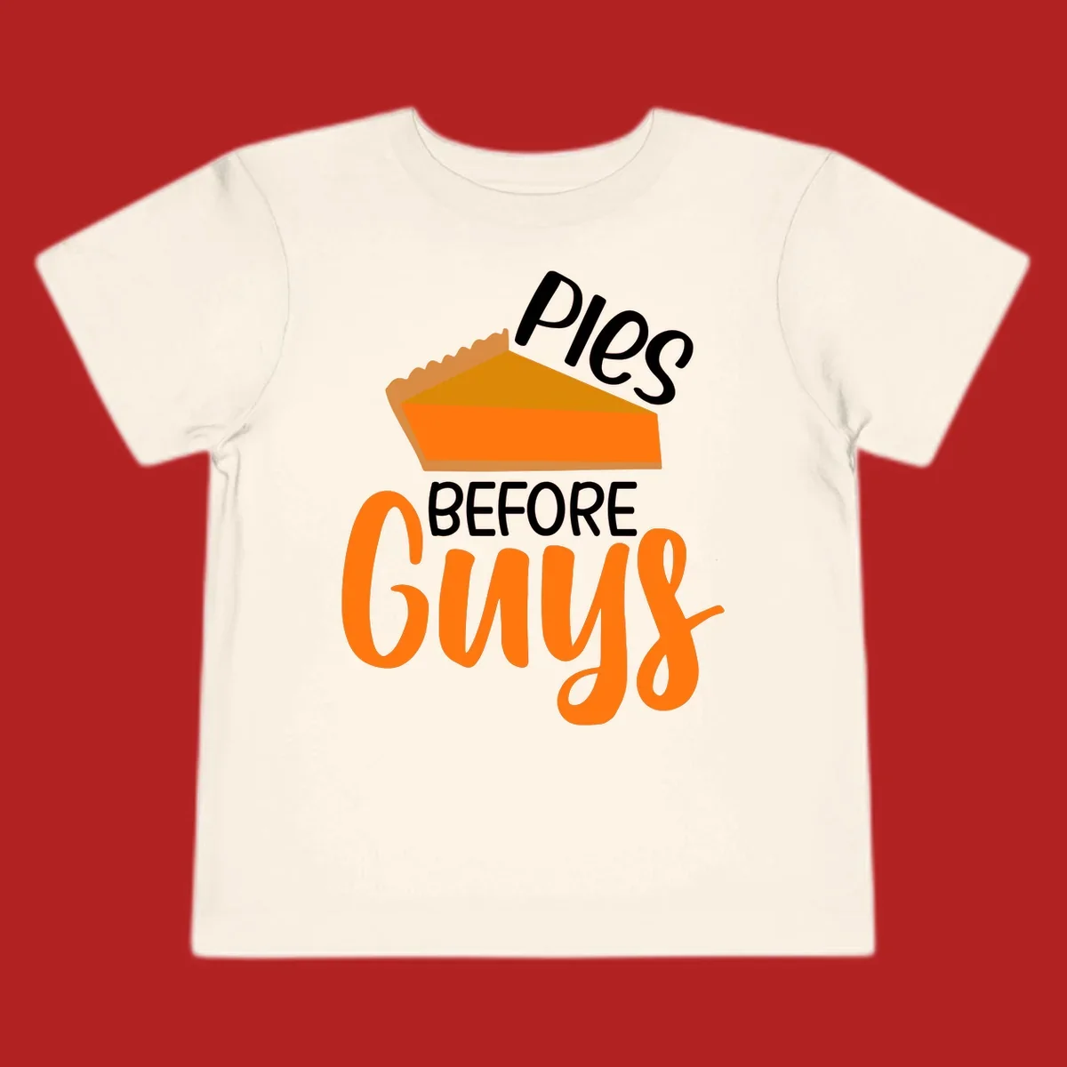 Illustration of a pumpkin pie slice with the text 'Pies BEFORE Guys', a popular Thanksgiving phrase.