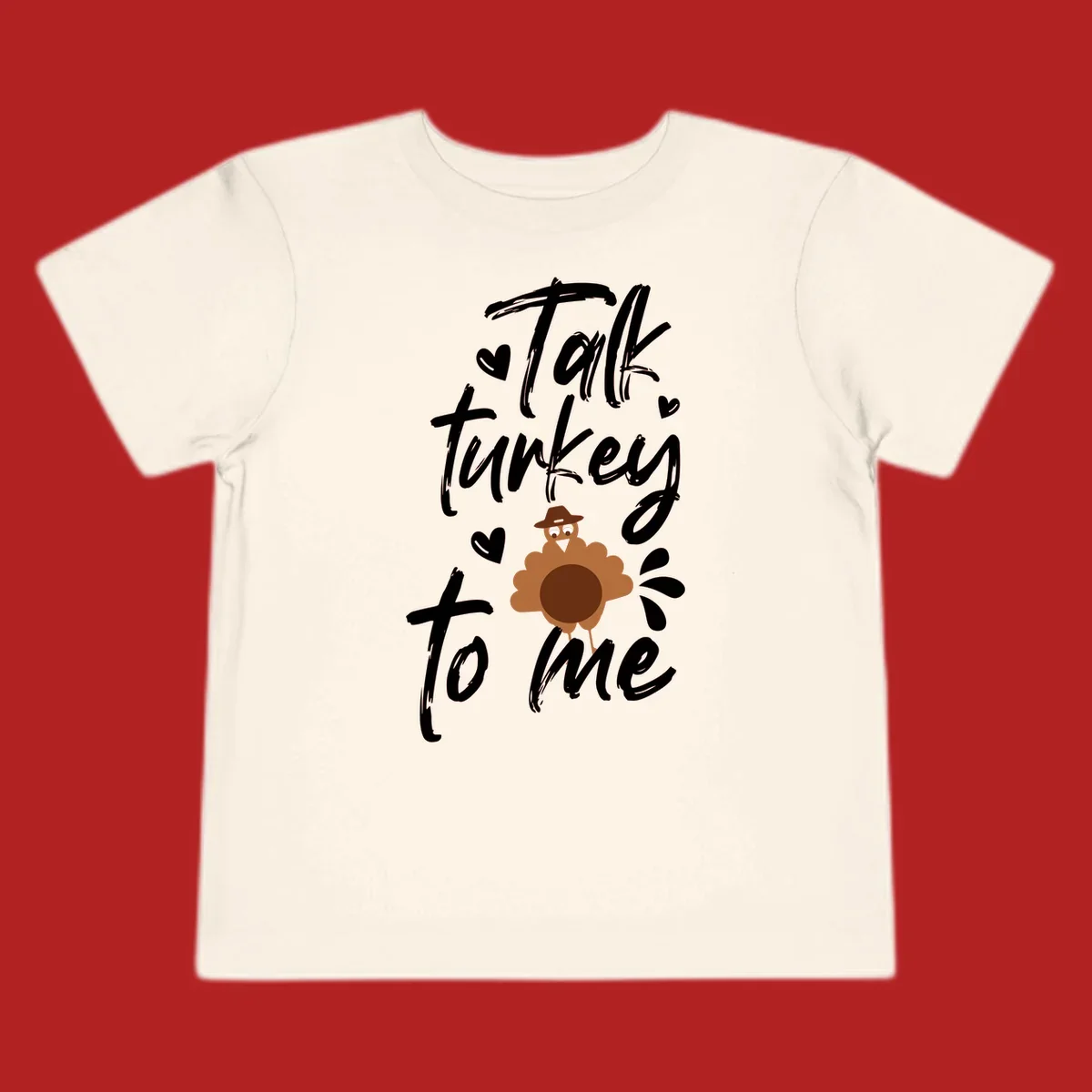 Talk turkey to me Thanksgiving graphic with a cute turkey and hearts.