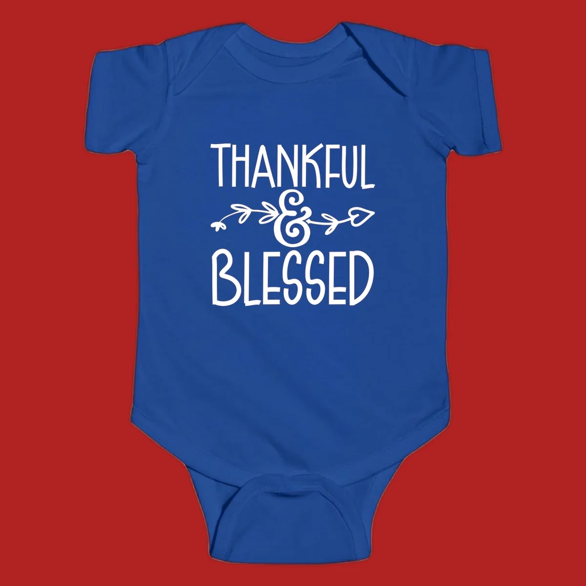 Thankful & Blessed typography design with decorative ampersand.