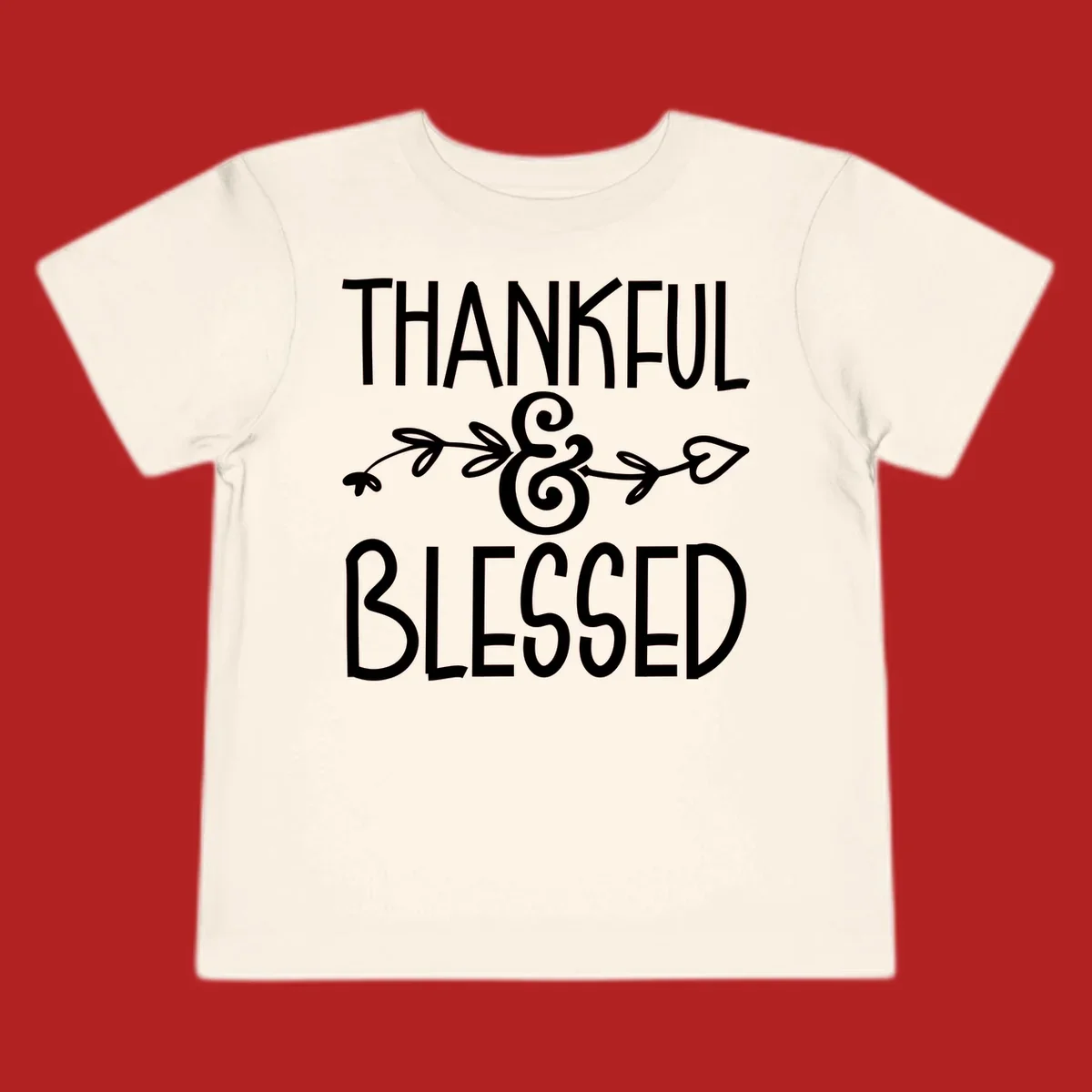 Thankful & Blessed typography design with decorative ampersand.