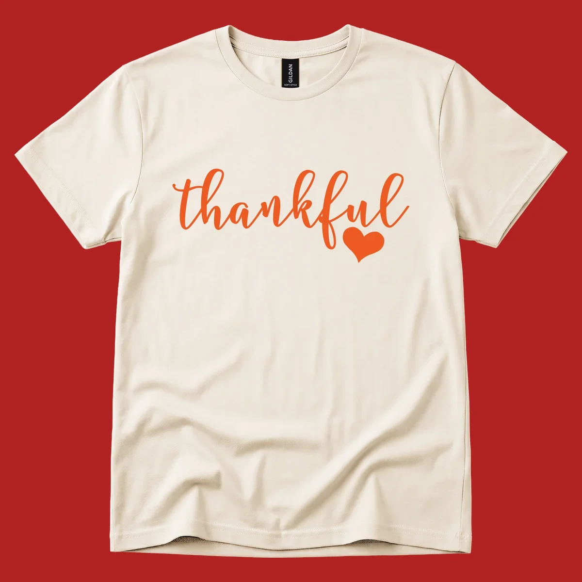 Orange script text 'thankful' with a heart accent, thankful-heart-script.