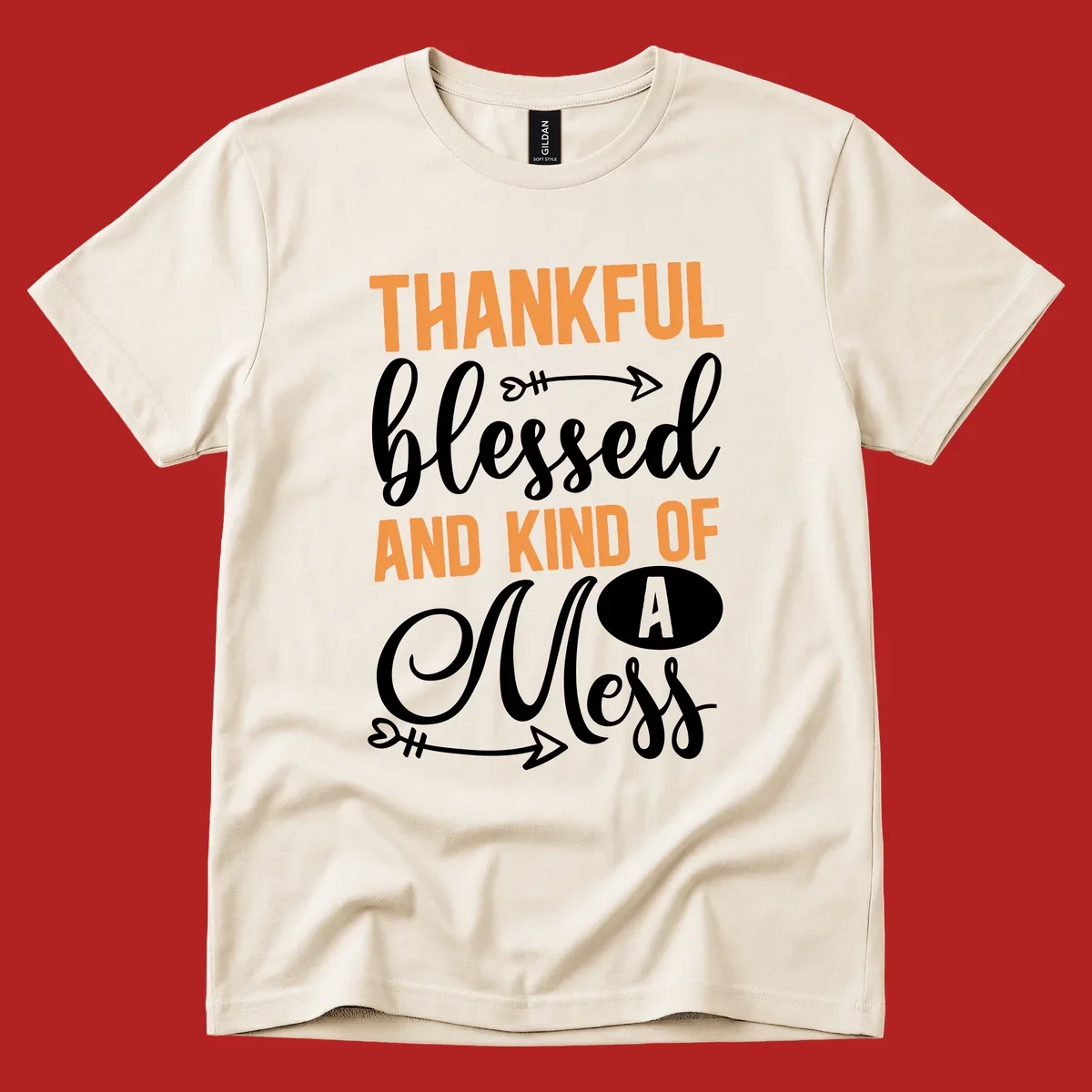 Thankful Blessed And Kind Of A Mess typography design with orange and white text on black background.