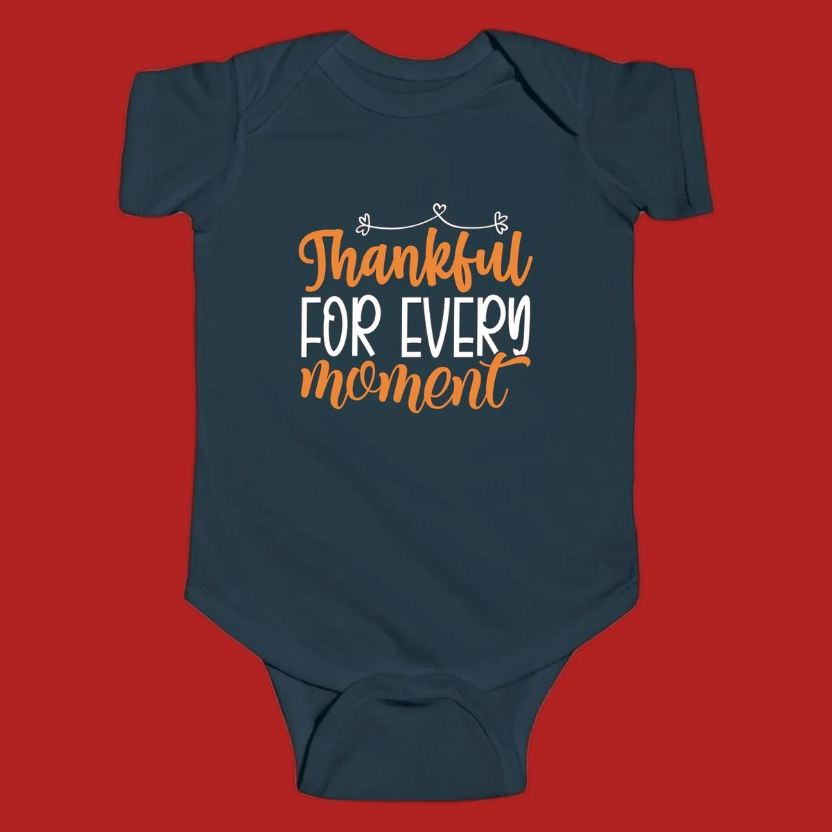 Thankful for every moment text design with orange and white lettering on black background.