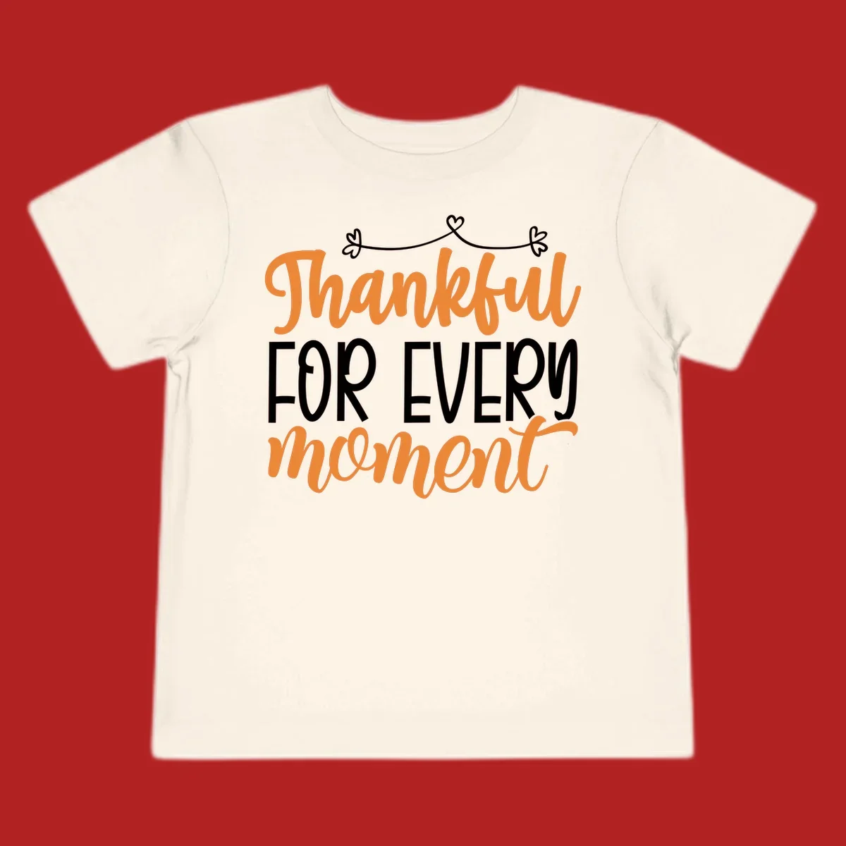 Thankful for every moment text design with orange and white lettering on black background.