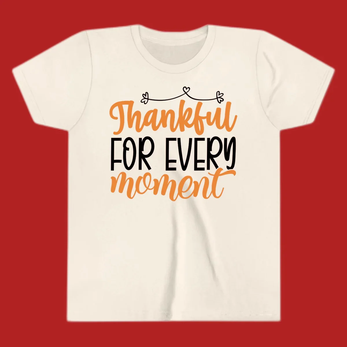 Thankful for every moment text design with orange and white lettering on black background.