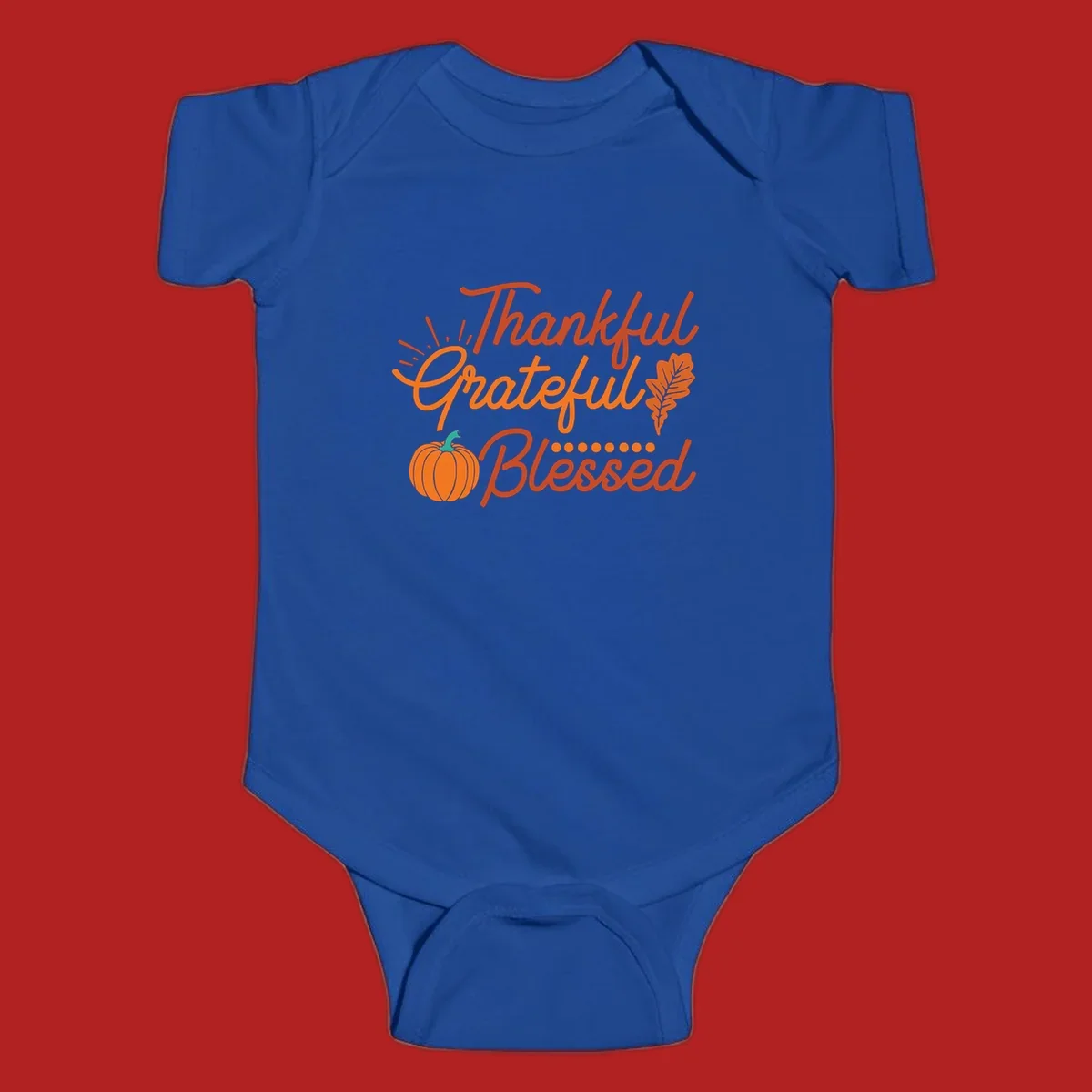 Thankful Grateful Blessed Thanksgiving design with pumpkin and oak leaf.