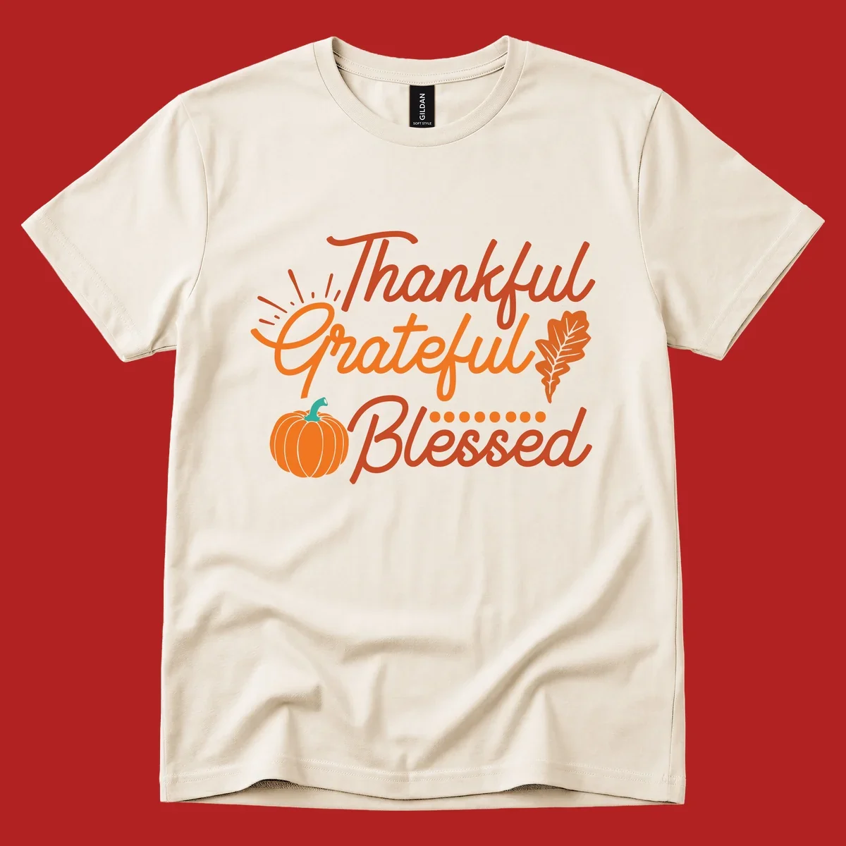 Thankful Grateful Blessed Thanksgiving design with pumpkin and oak leaf.