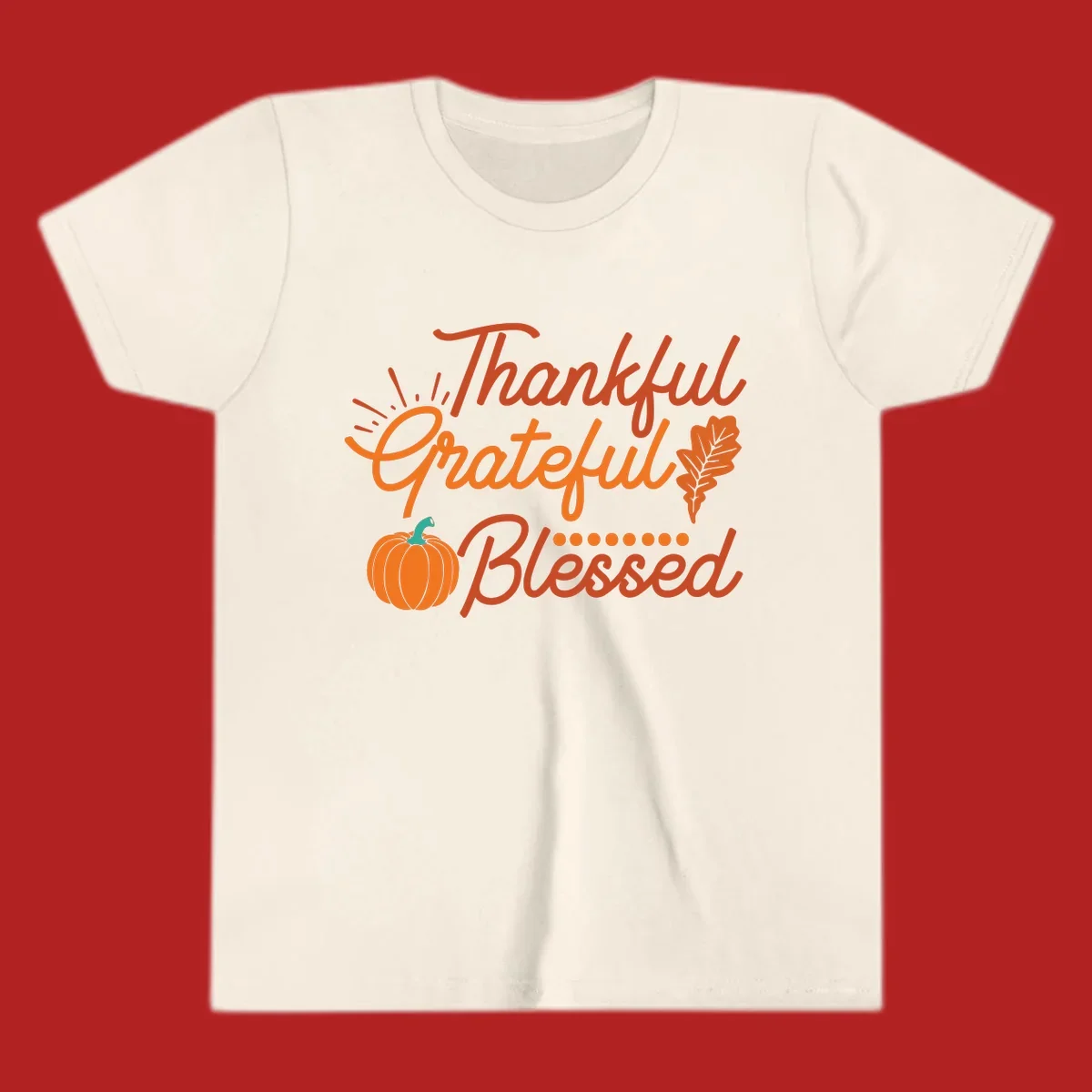 Thankful Grateful Blessed Thanksgiving design with pumpkin and oak leaf.