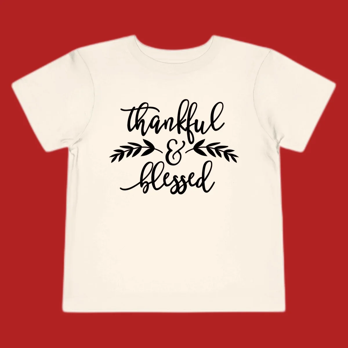 Thankful and Blessed script text with decorative leaves.